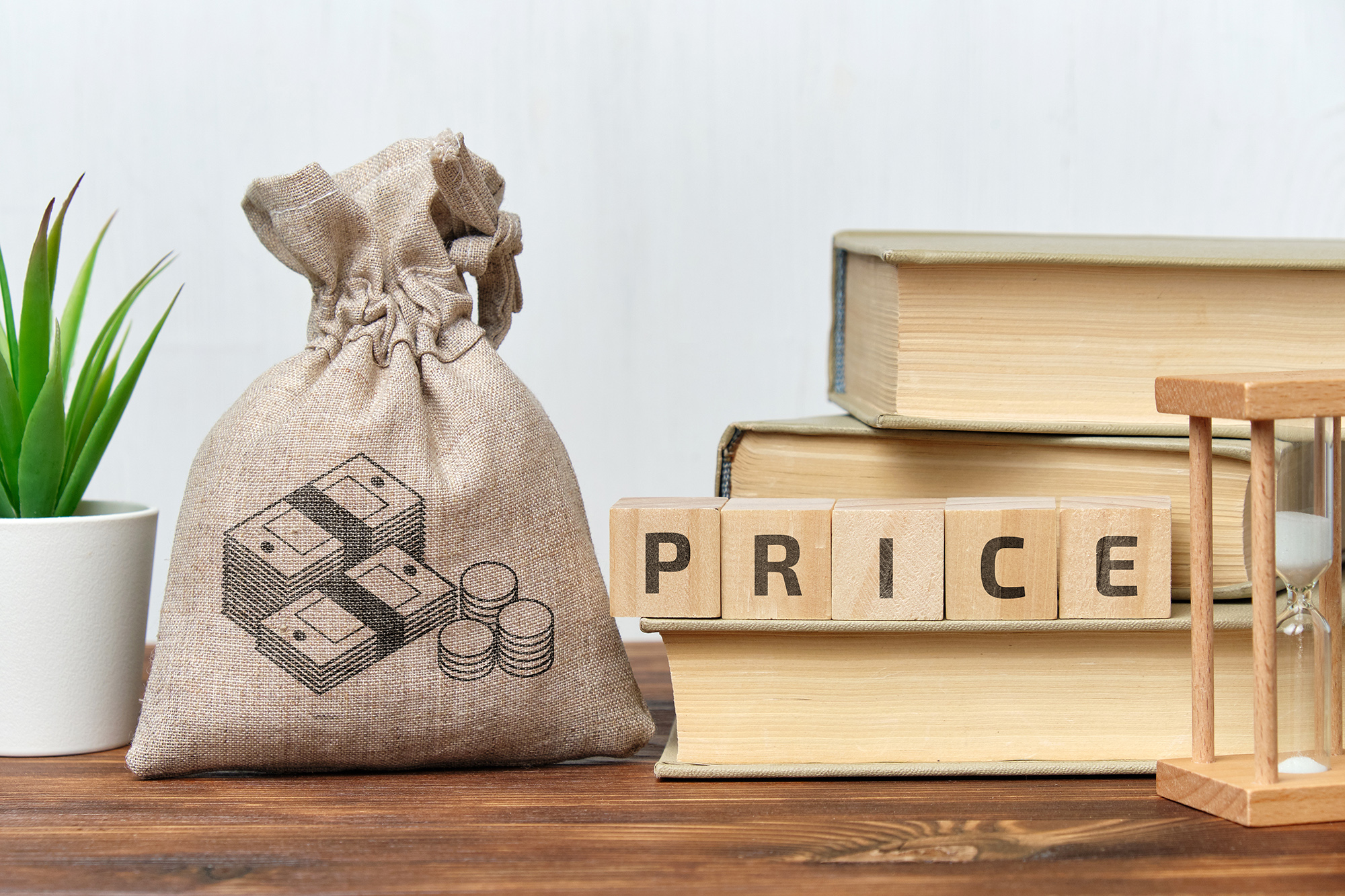Sugar price word on blocks and books on an table.